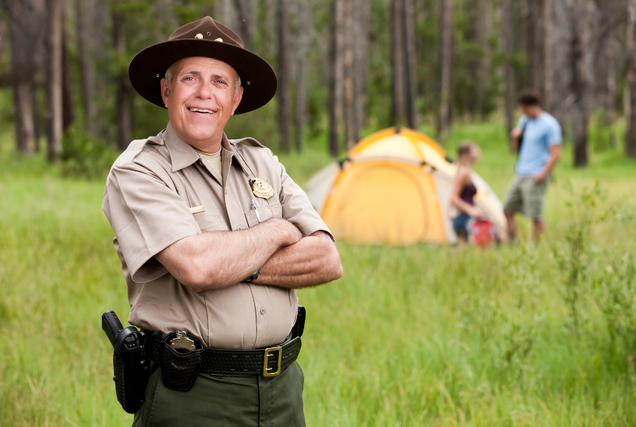 Ranger in front of tent camping