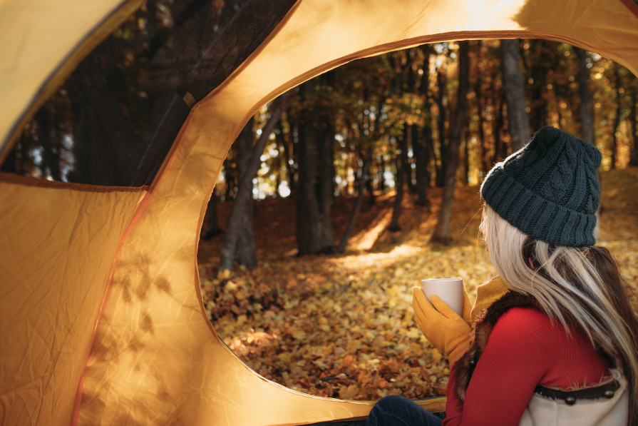 Woman camping in tent